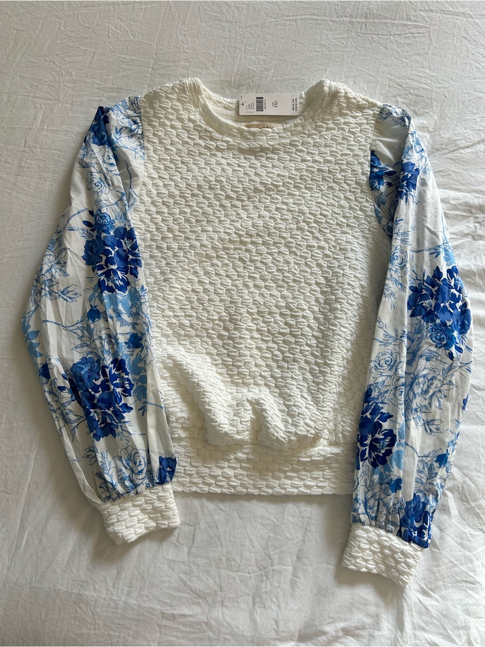 Anthropologie Cream Textured Sweater with Blue Floral Puff Sleeves